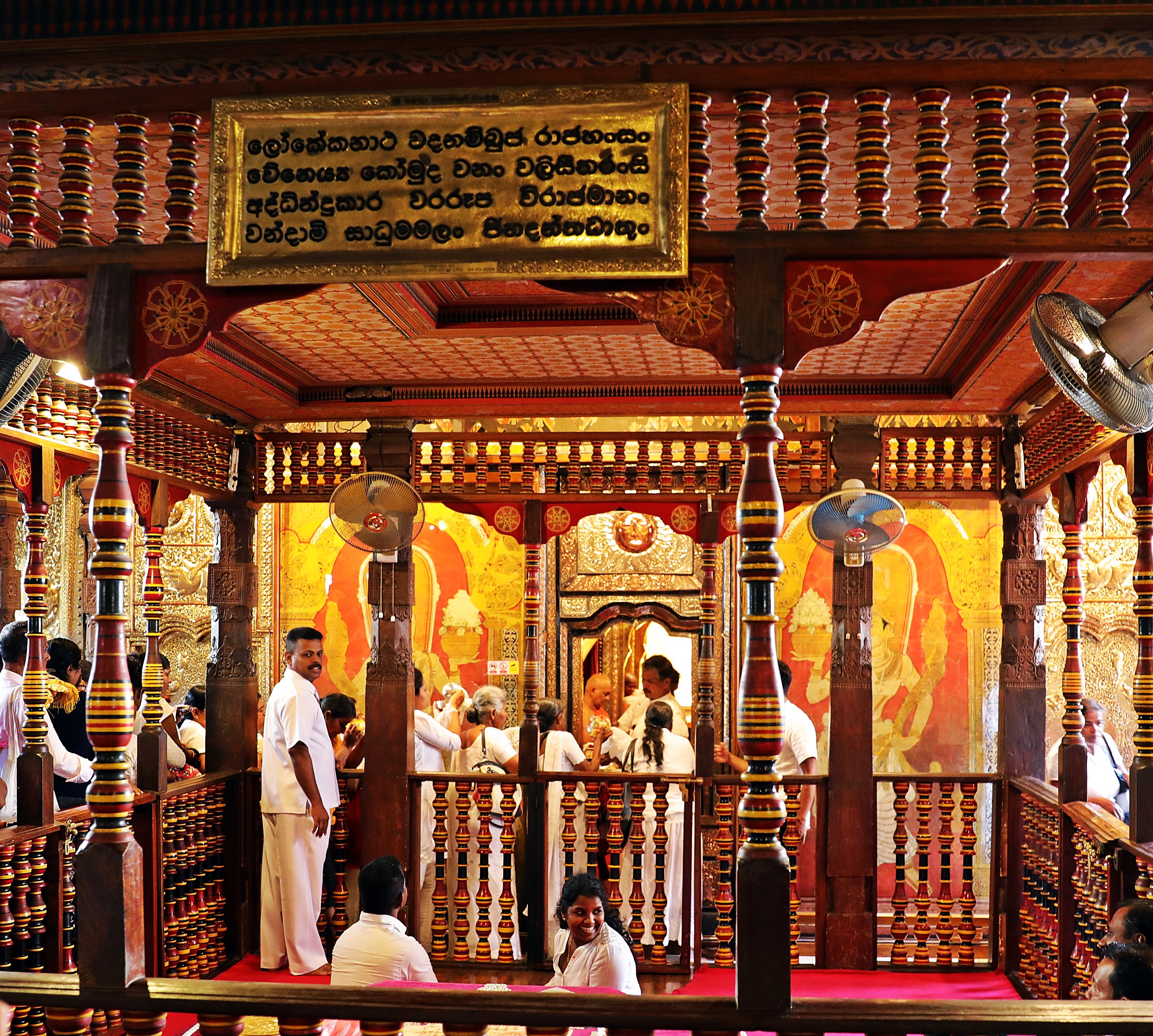 Pilgrims lined up at the golden doors, Temple of the Sacred Tooth Relic