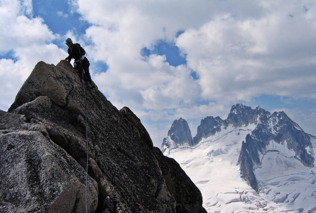 Climbing Bugaboo Spire with Howser Towers in the distance