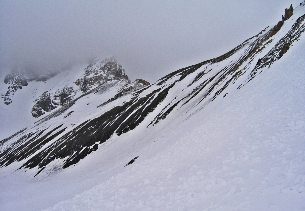 Avalanche debris before a wind-swept Sir Douglas-Robertson Col, French-Robertson Traverse
