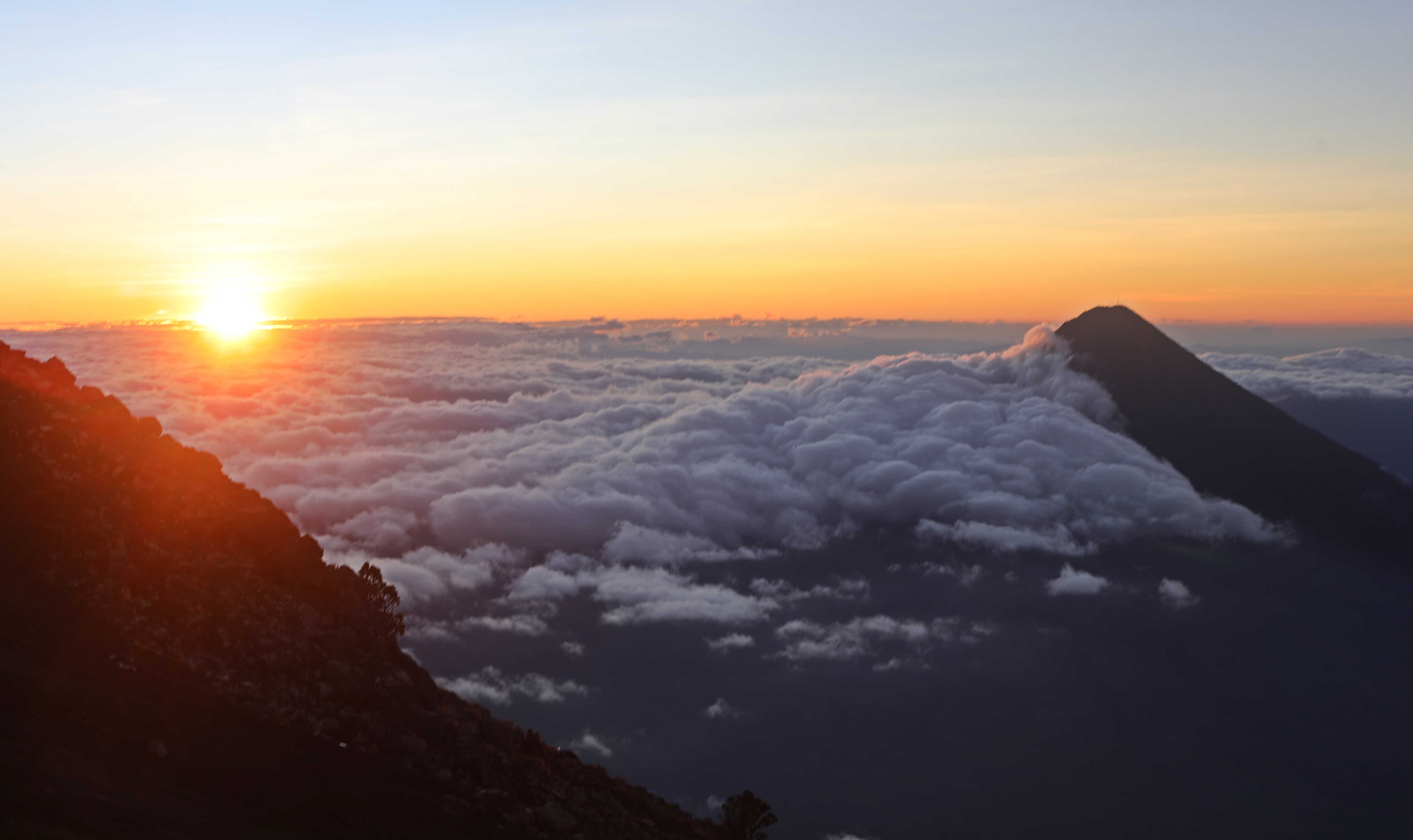 Sunrise behind Agua Volcano from Acatenango Volcano, Guatemala